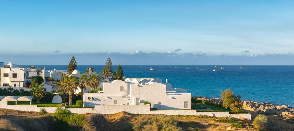 White buildings and blue sea on the Kelibia coast near Kerkuane, Cap Bon, Tunisia