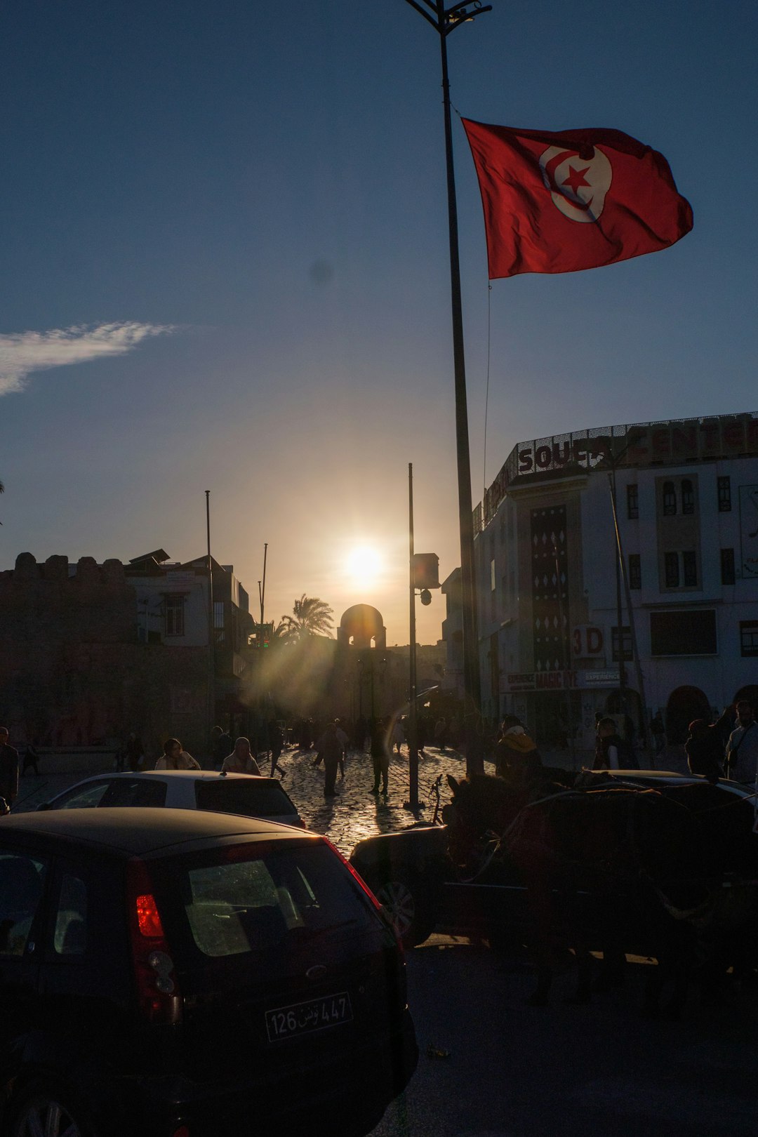 Tunisian flag at sunset over Tunis — coworking spaces and remote work guide for Tunisia