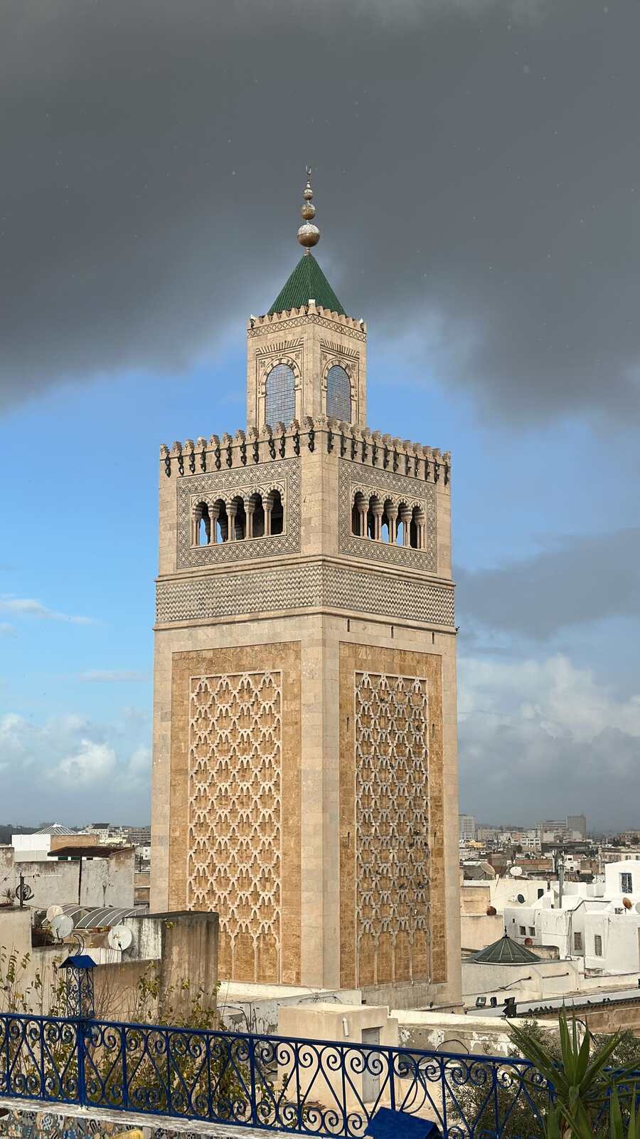 Minaret of the Great Mosque of Kairouan under a dramatic sky, Tunisia