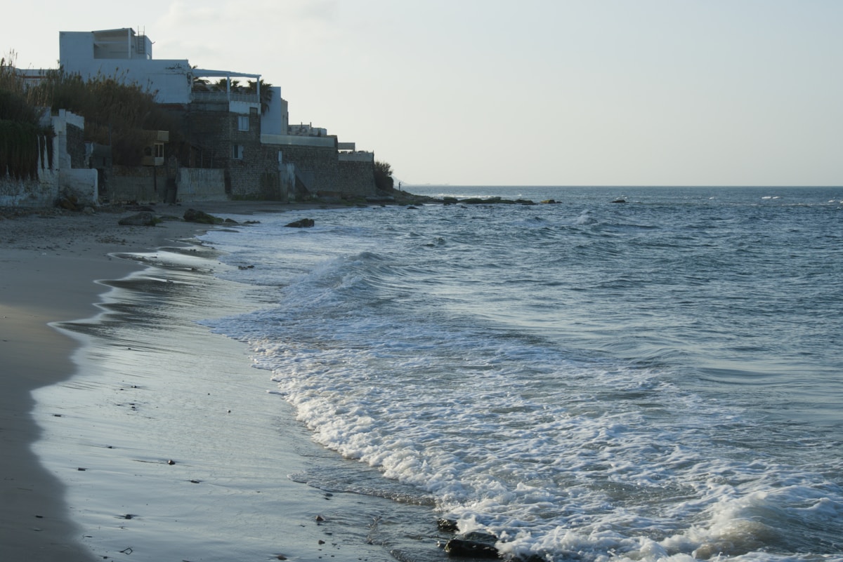 Mediterranean waves on a sandy Tunisian beach — the Cap Bon coast near Nabeul