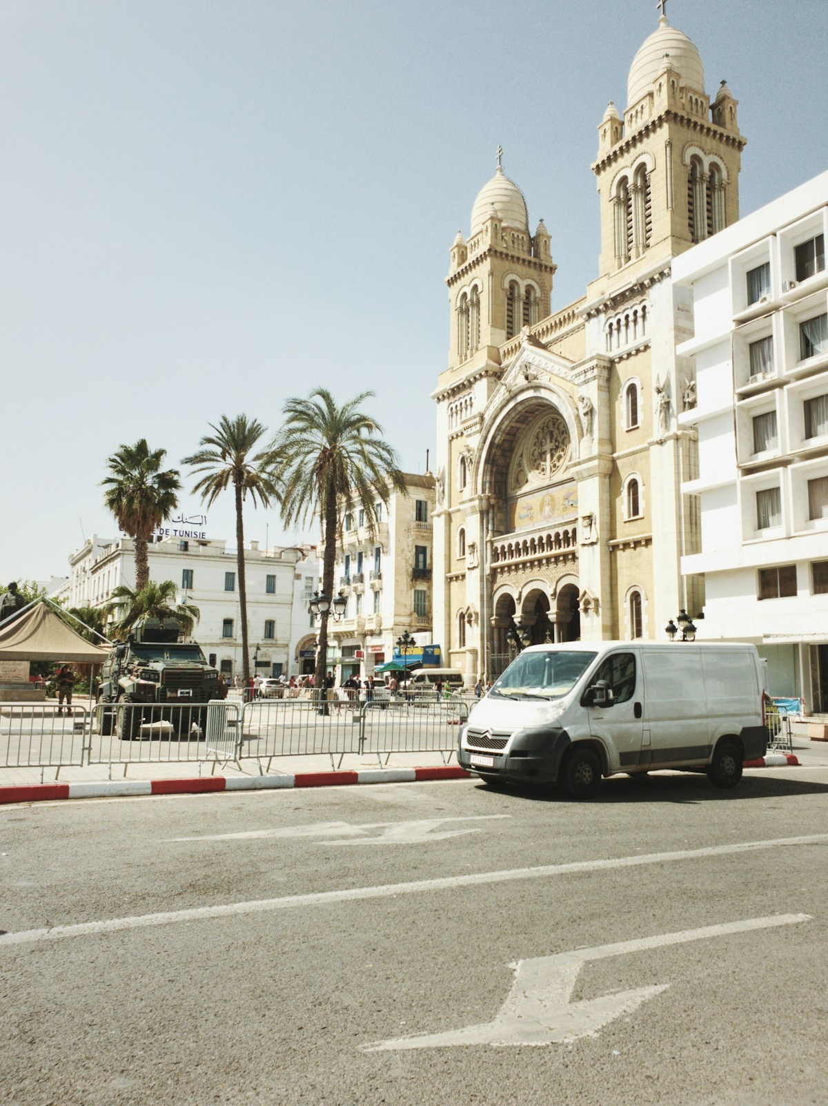 Van and traffic on a sunny street in central Tunis, Tunisia
