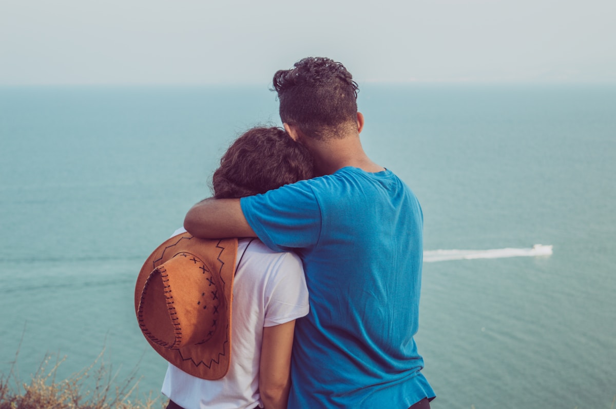 Couple overlooking the Mediterranean from a clifftop in Tunisia in August
